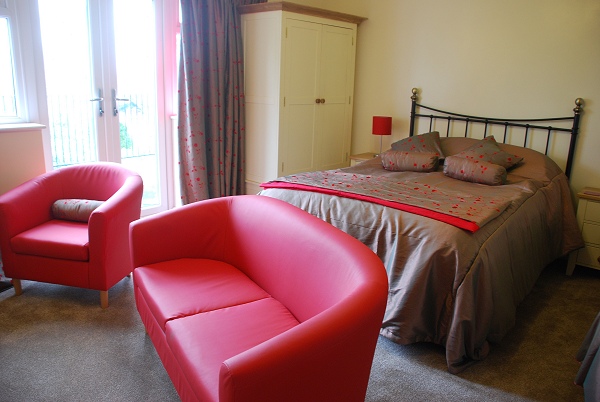 Large double en-suite bedroom with sofa